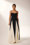 Women’s two-tone contrast maxi dress featuring a contoured black bodice, adjustable slim straps and a fitted waist that releases into an ivory panelled A-line skirt. Smooth, structured polyester shapes the figure; elegant choice for galas and evening events.