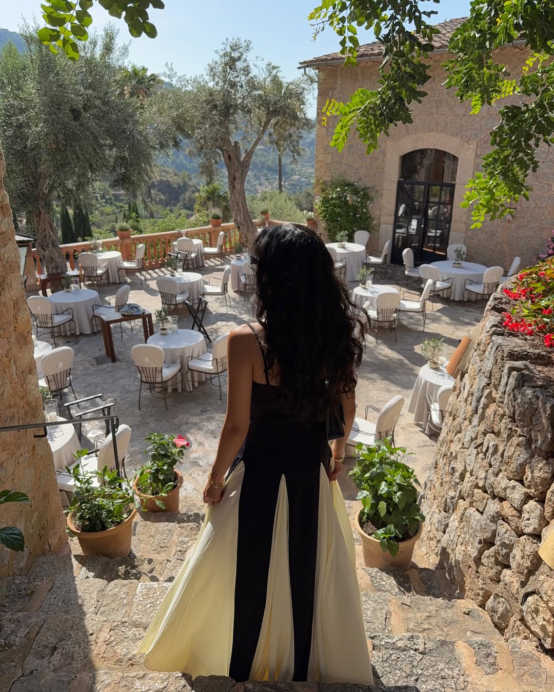 Women’s two-tone contrast maxi dress featuring a contoured black bodice, adjustable slim straps and a fitted waist that releases into an ivory panelled A-line skirt. Smooth, structured polyester shapes the figure; elegant choice for galas and evening events.