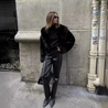 Women’s faux-fur coat in a plush, black finish featuring a wide lapel and a relaxed, waist-skimming silhouette. Soft, cosy texture adds refined warmth and layers effortlessly over dresses, denim or tailored looks for day-to-night elegance.