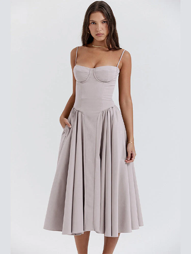 Women’s waist-shaper midi sundress with bustier cups, slender straps and a full, swingy skirt with side pockets. Contoured waist seam creates an hourglass effect; smooth, lightweight finish suits brunches, parties and summer evenings.