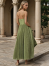 Women’s bustier sleeveless midi dress with a sweetheart neckline, contoured cups, tulle overlay, and an all-over pleated fit-and-flare skirt. Elegant, versatile piece for chic occasions, styled with heels or flats for polished looks.
