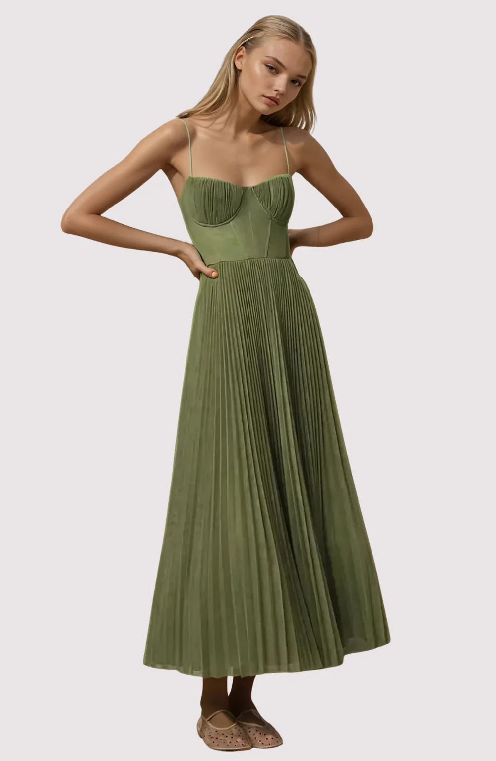 Women’s bustier sleeveless midi dress with a sweetheart neckline, contoured cups, tulle overlay, and an all-over pleated fit-and-flare skirt. Elegant, versatile piece for chic occasions, styled with heels or flats for polished looks.