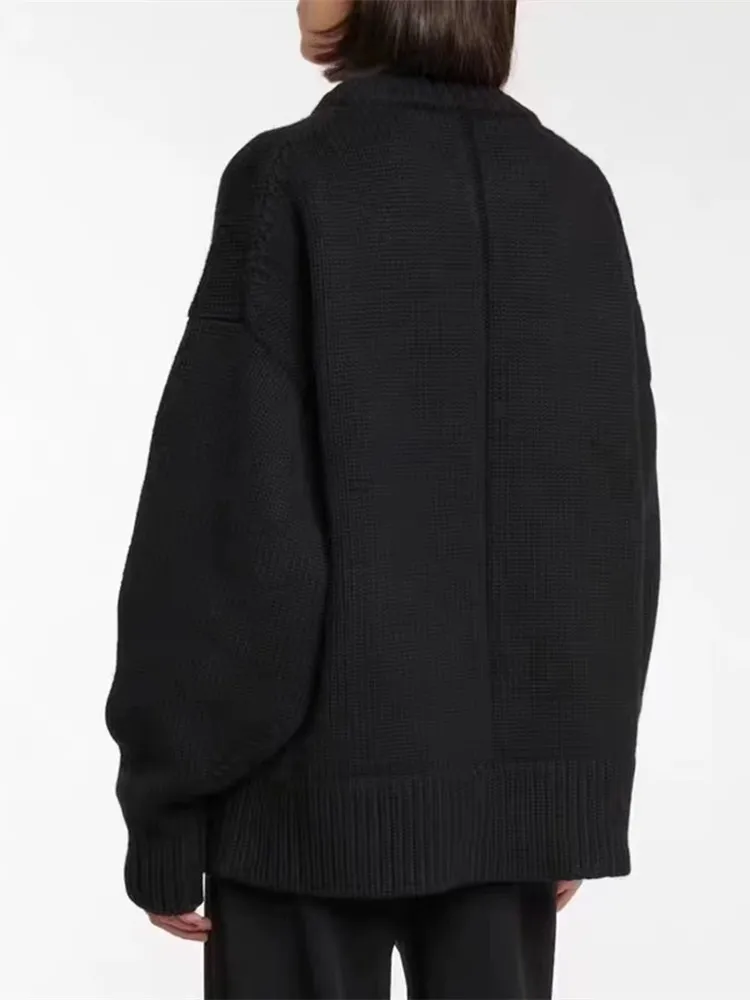 Hazel Beige Wool-Blend Oversized Knit Sweater with relaxed silhouette, soft wool blend and warm beige tone. Features slightly dropped shoulders plus ribbed cuffs and hem. Effortless layering over jeans, tailoring or dresses for refined cold-season style.