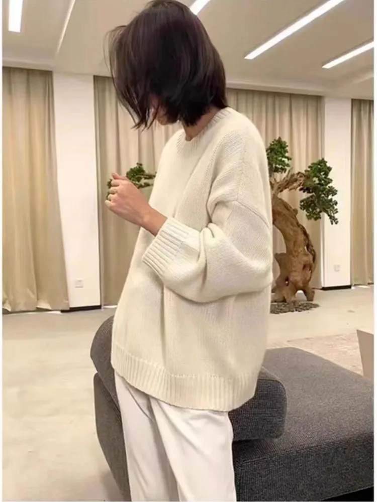 Hazel Beige Wool-Blend Oversized Knit Sweater with relaxed silhouette, soft wool blend and warm beige tone. Features slightly dropped shoulders plus ribbed cuffs and hem. Effortless layering over jeans, tailoring or dresses for refined cold-season style.