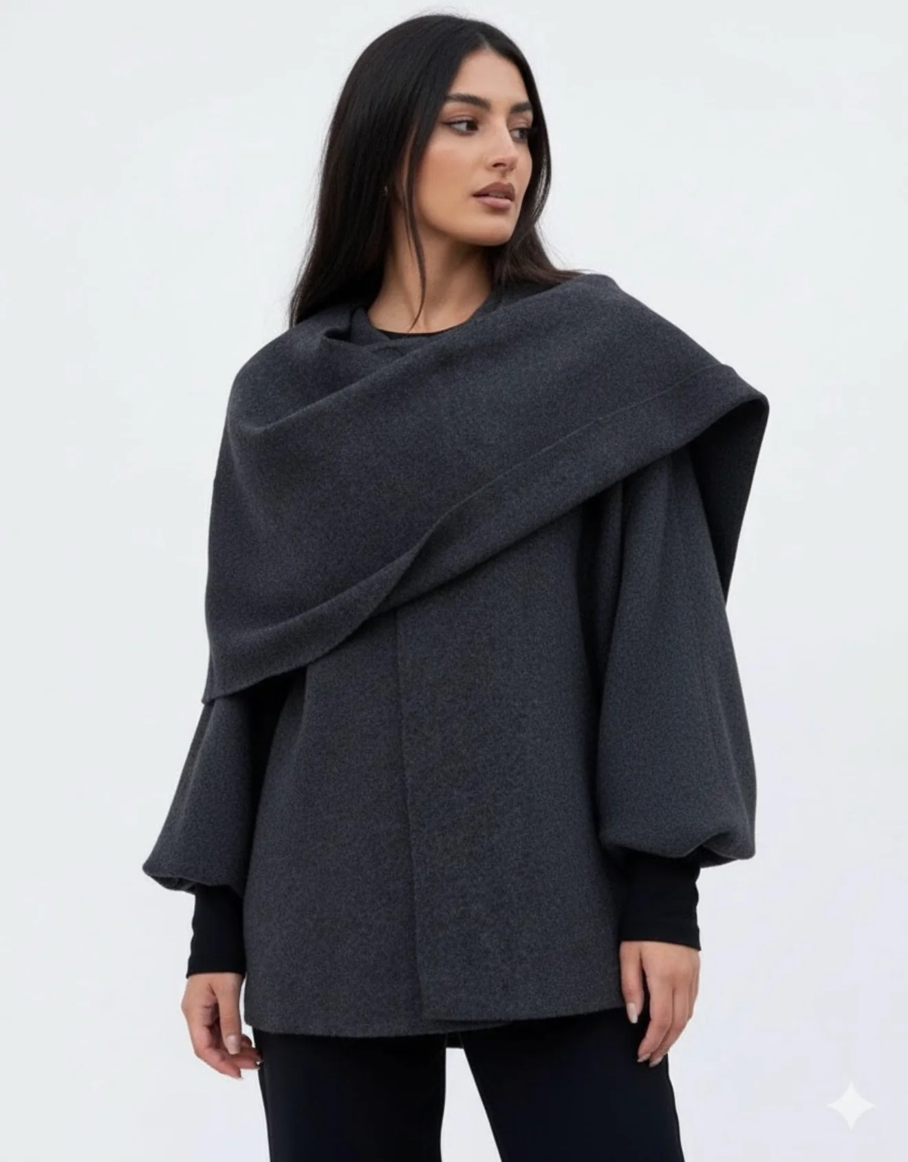 Women’s oversized warm coat featuring a draped, fold-over neckline, relaxed cocoon silhouette and asymmetric hem. Soft-touch construction adds cosy warmth without bulk, layering smoothly over knitwear, dresses or tailoring for refined everyday style.