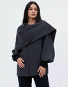 Women’s oversized warm coat featuring a draped, fold-over neckline, relaxed cocoon silhouette and asymmetric hem. Soft-touch construction adds cosy warmth without bulk, layering smoothly over knitwear, dresses or tailoring for refined everyday style.