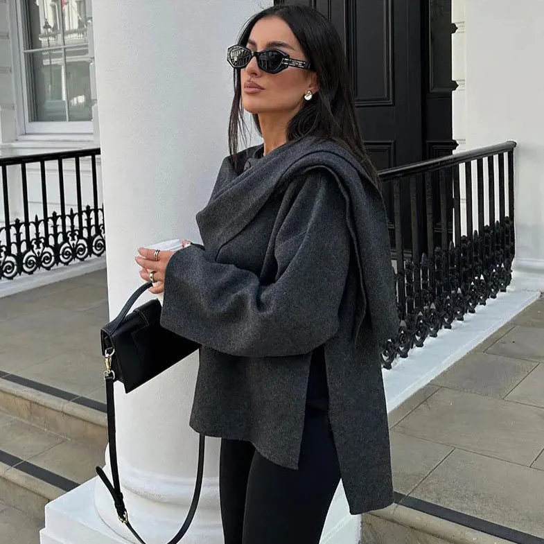 Women’s oversized warm coat featuring a draped, fold-over neckline, relaxed cocoon silhouette and asymmetric hem. Soft-touch construction adds cosy warmth without bulk, layering smoothly over knitwear, dresses or tailoring for refined everyday style.