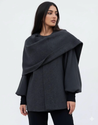 Women’s oversized warm coat featuring a draped, fold-over neckline, relaxed cocoon silhouette and asymmetric hem. Soft-touch construction adds cosy warmth without bulk, layering smoothly over knitwear, dresses or tailoring for refined everyday style.