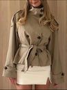 Cath cropped trench coat in a premium cotton-blend fabric with high neck, double-breasted closure, epaulettes, adjustable cuffs and waist-defining belt. Versatile autumn layer to pair with jeans, skirts or tailored trousers.