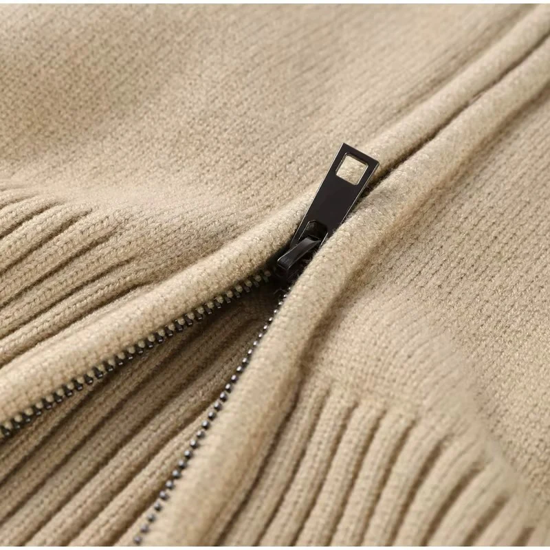 Women’s zip-up knit cardigan with high ribbed collar, full front zipper, and ribbed cuffs and hem. Soft stretch knit and a gently cropped, waist-skimming fit make it perfect for layering under coats or pairing with denim and tailored pants.