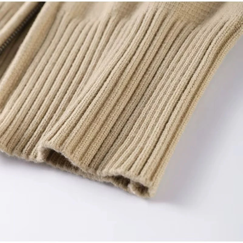 Women’s zip-up knit cardigan with high ribbed collar, full front zipper, and ribbed cuffs and hem. Soft stretch knit and a gently cropped, waist-skimming fit make it perfect for layering under coats or pairing with denim and tailored pants.