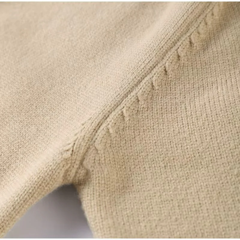 Women’s zip-up knit cardigan with high ribbed collar, full front zipper, and ribbed cuffs and hem. Soft stretch knit and a gently cropped, waist-skimming fit make it perfect for layering under coats or pairing with denim and tailored pants.