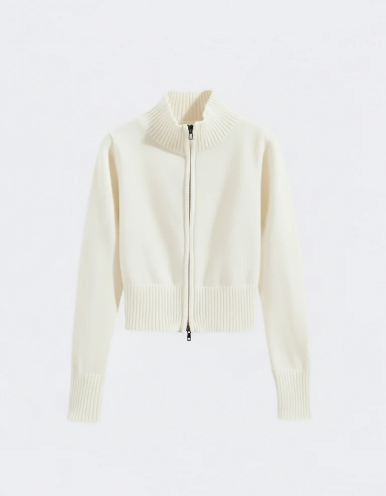 Women’s zip-up knit cardigan with high ribbed collar, full front zipper, and ribbed cuffs and hem. Soft stretch knit and a gently cropped, waist-skimming fit make it perfect for layering under coats or pairing with denim and tailored pants.
