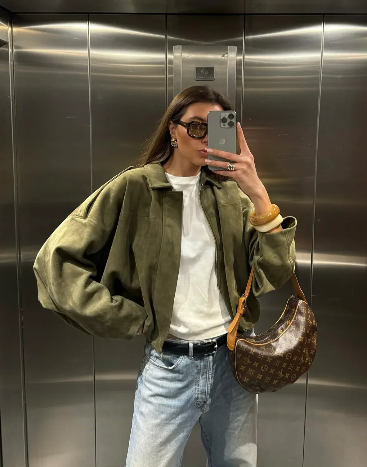 Suede-textured pilot jacket featuring a relaxed silhouette with batwing sleeves, clean front fastening and paneled construction. Medium-weight feel adds warmth without bulk, creating an effortless layer over tees, knits or dresses for city-ready style.