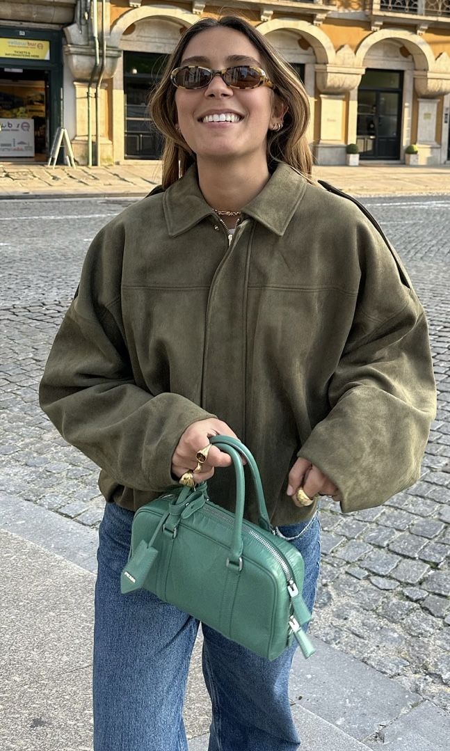 Suede-textured pilot jacket featuring a relaxed silhouette with batwing sleeves, clean front fastening and paneled construction. Medium-weight feel adds warmth without bulk, creating an effortless layer over tees, knits or dresses for city-ready style.