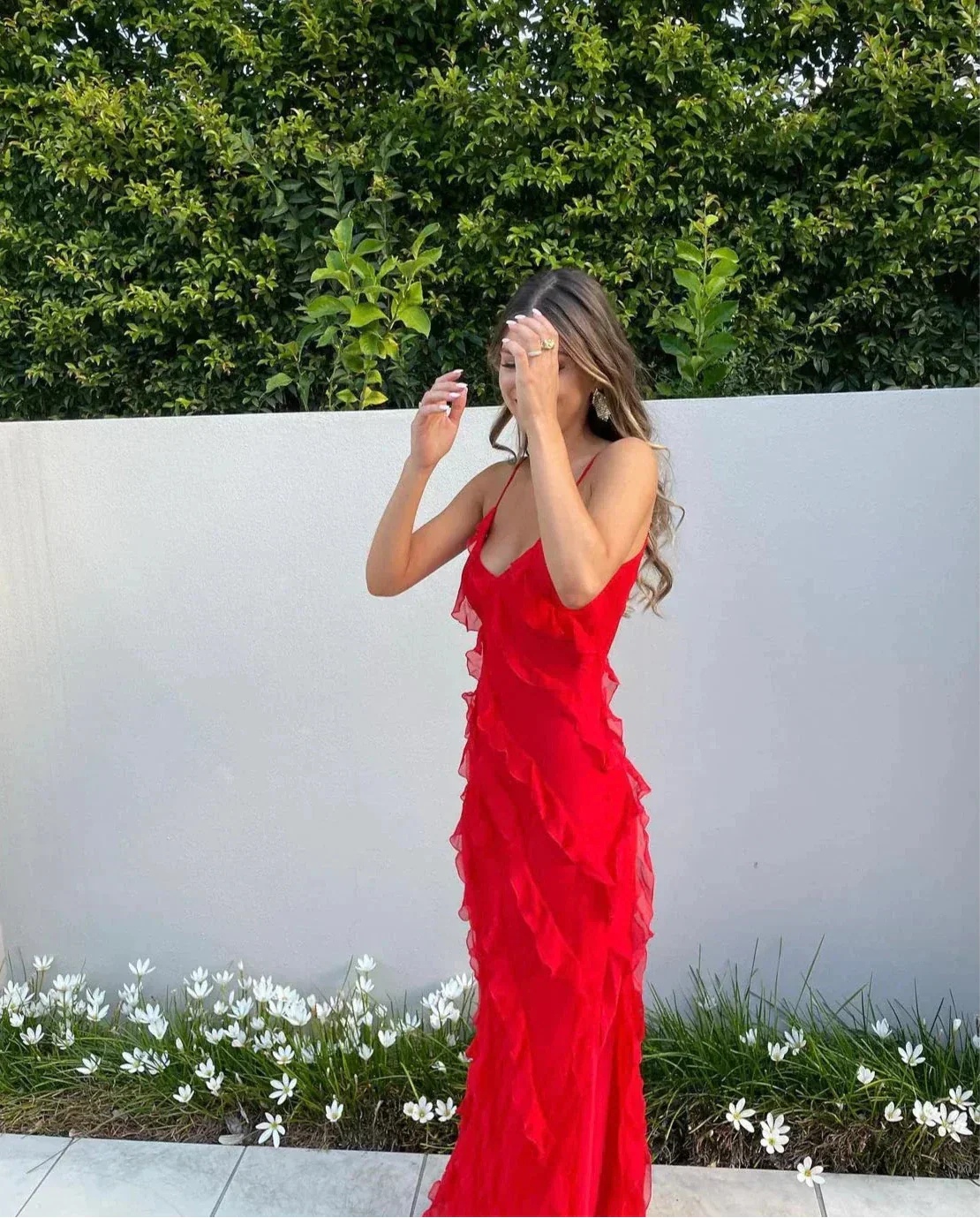 Women’s elegant tulle maxi dress with slender straps, open back and ruched waist. Floaty, ruffled texture and subtle side slit deliver graceful movement. A floor-skimming hem elongates for polished wedding or evening looks.