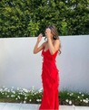 Women’s elegant tulle maxi dress with slender straps, open back and ruched waist. Floaty, ruffled texture and subtle side slit deliver graceful movement. A floor-skimming hem elongates for polished wedding or evening looks.