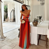 Laney strapless maxi dress featuring a twist-front neckline, waist cutouts, and an ombré A-line skirt. Lightweight, flowing silhouette designed for summer weddings, beach parties, and resort dinners with effortless elegance.