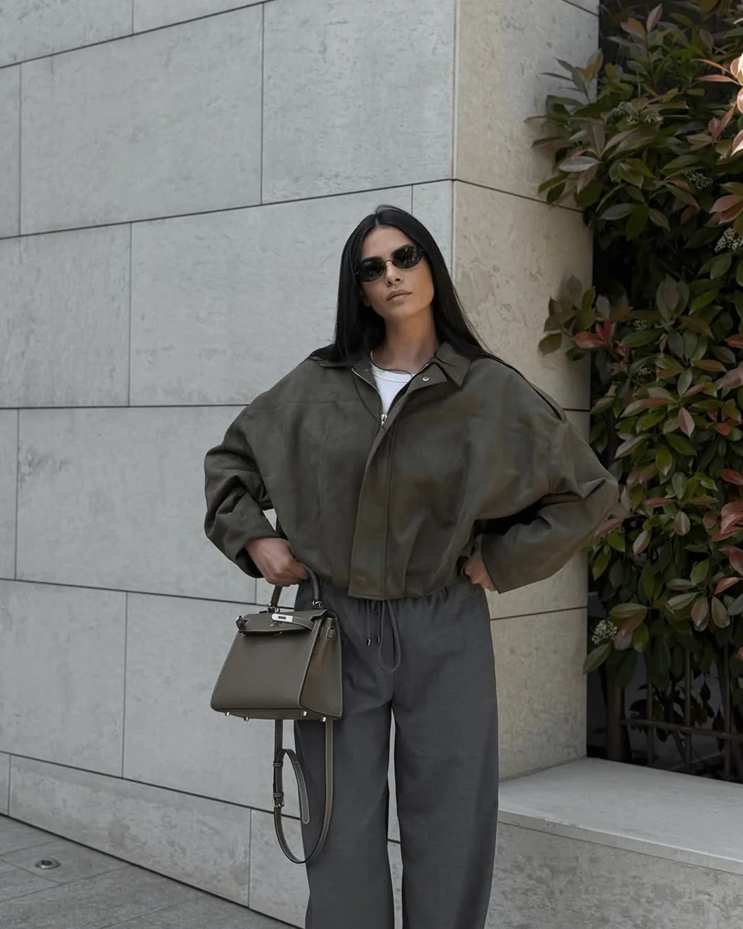 Faux suede bomber jacket in olive green featuring a structured collar, hidden front fastening and relaxed, easy-to-layer silhouette; a versatile outer layer for autumn and spring, pairing with denim, knits or tailored trousers.