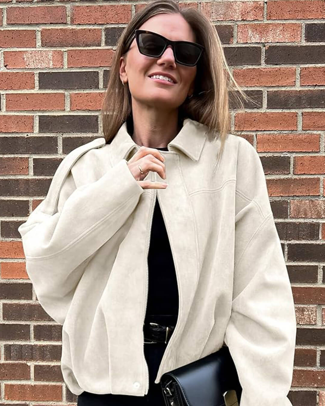 Faux suede bomber jacket in olive green featuring a structured collar, hidden front fastening and relaxed, easy-to-layer silhouette; a versatile outer layer for autumn and spring, pairing with denim, knits or tailored trousers.