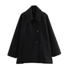 Women’s oversized collared coat in a hip-length cut with dropped shoulders, side slits, clean button front and deep hand pockets. Minimalist lines create a smooth drape over knitwear or dresses, delivering a refined, easy-to-style winter layer.
