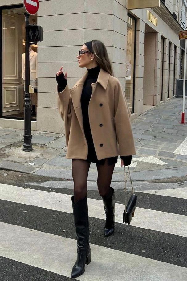 Women’s oversized collared coat in a hip-length cut with dropped shoulders, side slits, clean button front and deep hand pockets. Minimalist lines create a smooth drape over knitwear or dresses, delivering a refined, easy-to-style winter layer.