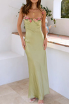 Floral satin-effect maxi dress featuring underwire cups, delicate embroidery along the bust and thin adjustable spaghetti straps. Soft, lightweight 100% polyester with a subtle sheen and a body-hugging, elongated silhouette ideal for weddings and evenings.
