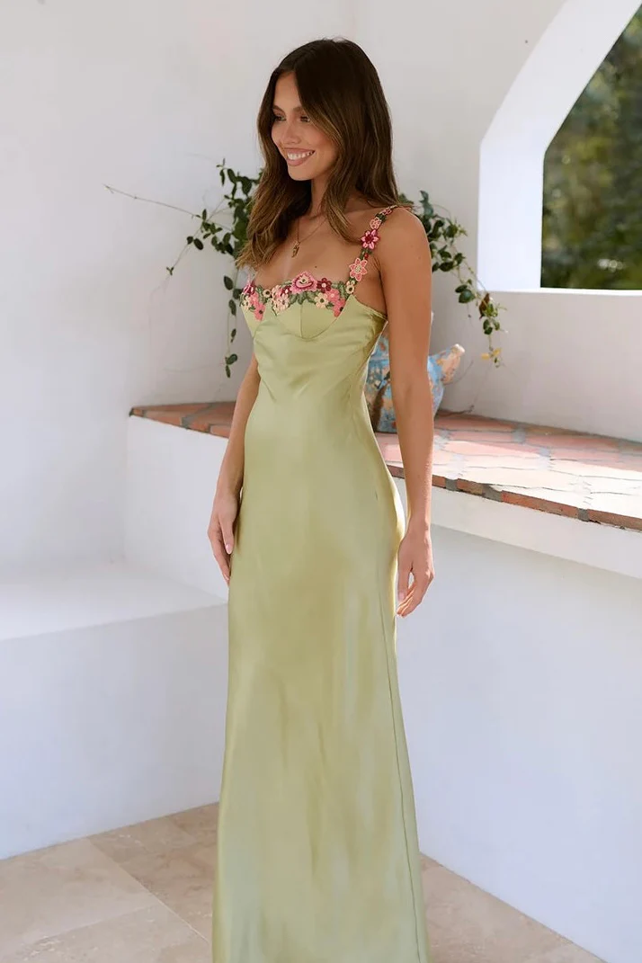 Floral satin-effect maxi dress featuring underwire cups, delicate embroidery along the bust and thin adjustable spaghetti straps. Soft, lightweight 100% polyester with a subtle sheen and a body-hugging, elongated silhouette ideal for weddings and evenings.
