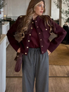 Lilly cropped jacket in deep burgundy featuring statement gold buttons, front flap pockets and a clean, collarless neckline. Soft yet structured woven fabric flatters the waist and layers over dresses, denim or tailoring for refined desk-to-dinner style.