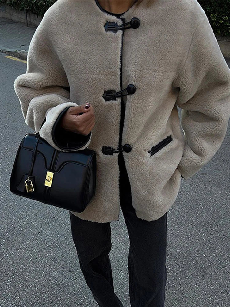 Liz Faux Shearling Toggle Coat in plush polyester with contrast black trim, classic toggle fastenings, smooth inner lining and practical side pockets. Relaxed yet structured silhouette designed for comfortable layering over knits or tailoring in autumn and winter.