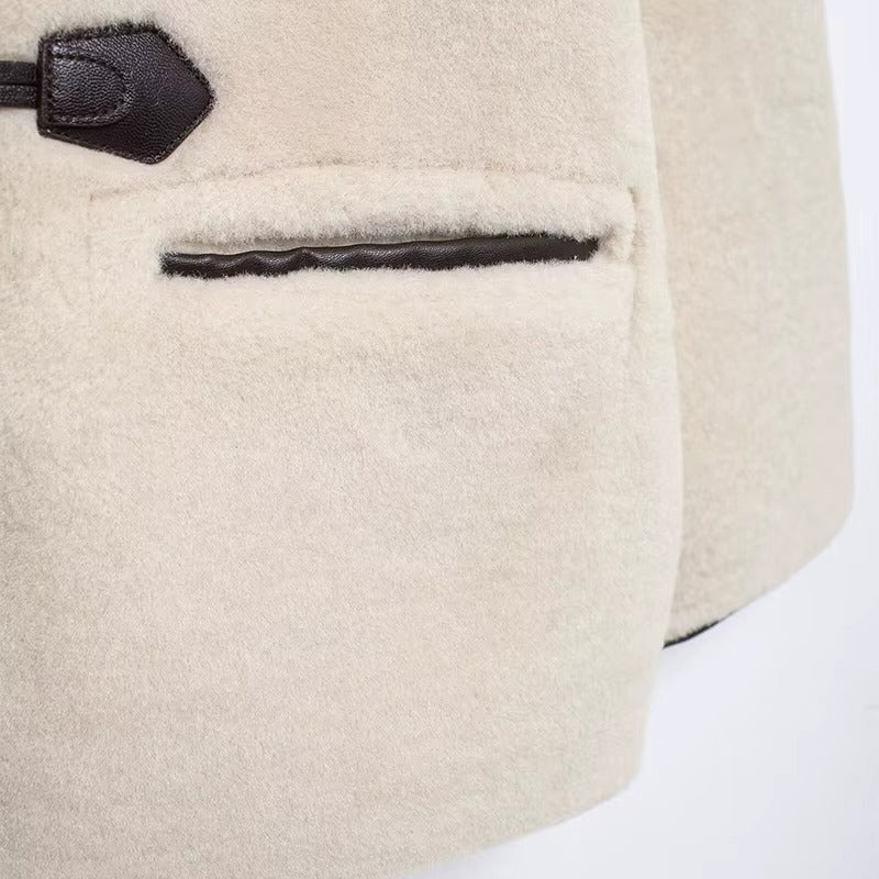 Liz Faux Shearling Toggle Coat in plush polyester with contrast black trim, classic toggle fastenings, smooth inner lining and practical side pockets. Relaxed yet structured silhouette designed for comfortable layering over knits or tailoring in autumn and winter.