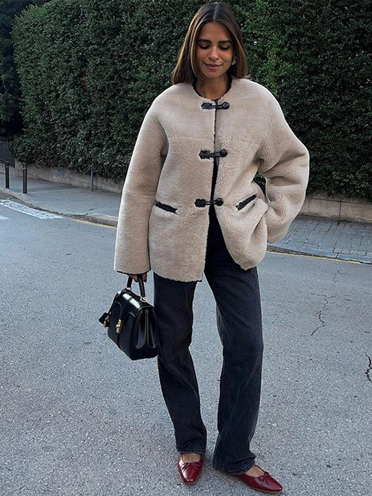 Liz Faux Shearling Toggle Coat in plush polyester with contrast black trim, classic toggle fastenings, smooth inner lining and practical side pockets. Relaxed yet structured silhouette designed for comfortable layering over knits or tailoring in autumn and winter.