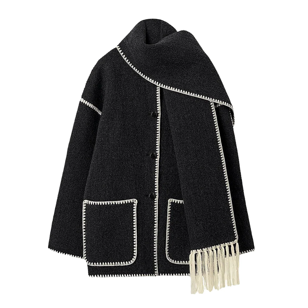 Vintage-inspired jacket in black or grey featuring an integrated scarf with fringe, contrast whipstitch edging, button front and large patch pockets. Relaxed straight silhouette in soft-touch fabric for cozy, stylish layering in cooler weather.