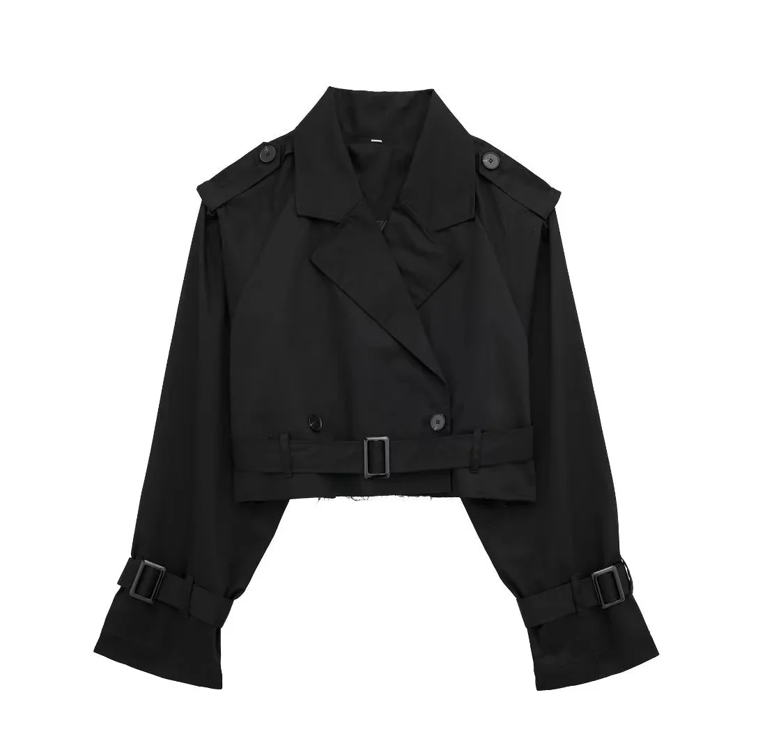 Cropped trench coat featuring a belted waist, subtle shoulder epaulettes, functional storm flap, cuff straps and deep front pockets. A hip-skimming, lightweight layer that pairs with high-waist trousers or dresses for effortless transitional styling.