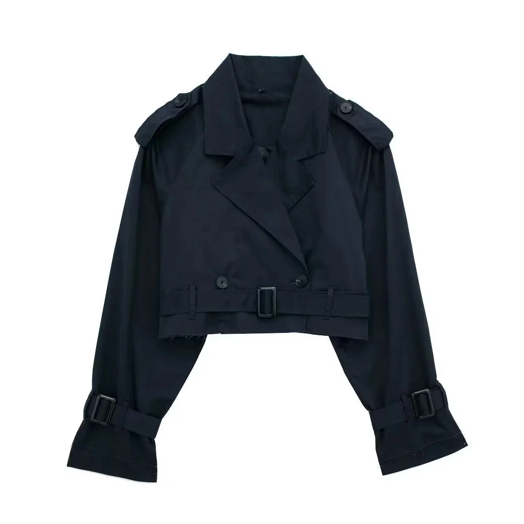 Cropped trench coat featuring a belted waist, subtle shoulder epaulettes, functional storm flap, cuff straps and deep front pockets. A hip-skimming, lightweight layer that pairs with high-waist trousers or dresses for effortless transitional styling.