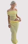Off-shoulder mesh maxi dress featuring a ruched neckline, sheer waist accent and draped, sarong-like overlay over a column skirt. Body-skimming silhouette with pull-on ease, ideal for cocktails, soirées and chic summer events.