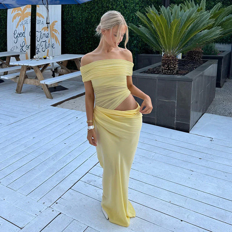 Off-shoulder mesh maxi dress featuring a ruched neckline, sheer waist accent and draped, sarong-like overlay over a column skirt. Body-skimming silhouette with pull-on ease, ideal for cocktails, soirées and chic summer events.
