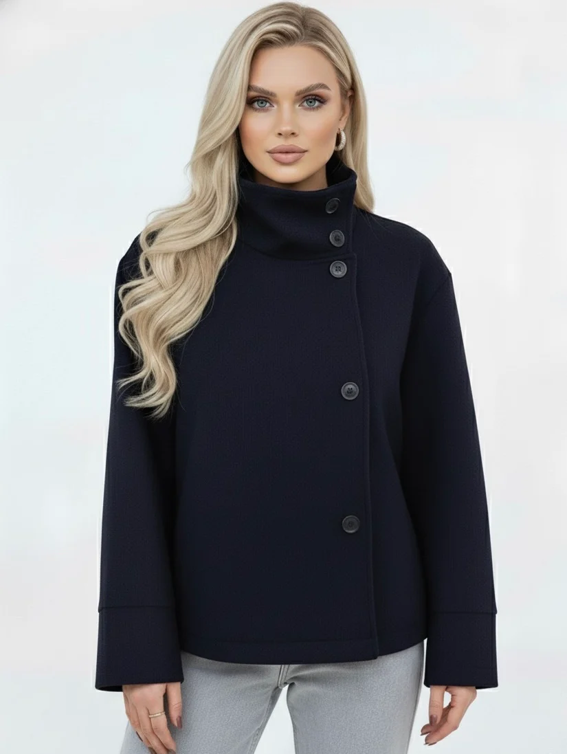 Martha High-Neck Wool-Blend Jacket featuring a structured stand collar, asymmetric button closure, smooth inner lining and a relaxed, slightly cropped silhouette. A warm yet polished layer that pairs with tailored trousers or high-waisted denim for transitional days.