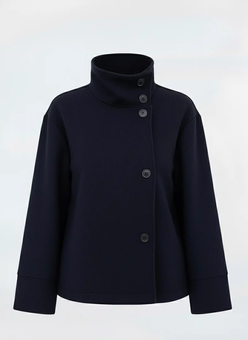 Martha High-Neck Wool-Blend Jacket featuring a structured stand collar, asymmetric button closure, smooth inner lining and a relaxed, slightly cropped silhouette. A warm yet polished layer that pairs with tailored trousers or high-waisted denim for transitional days.