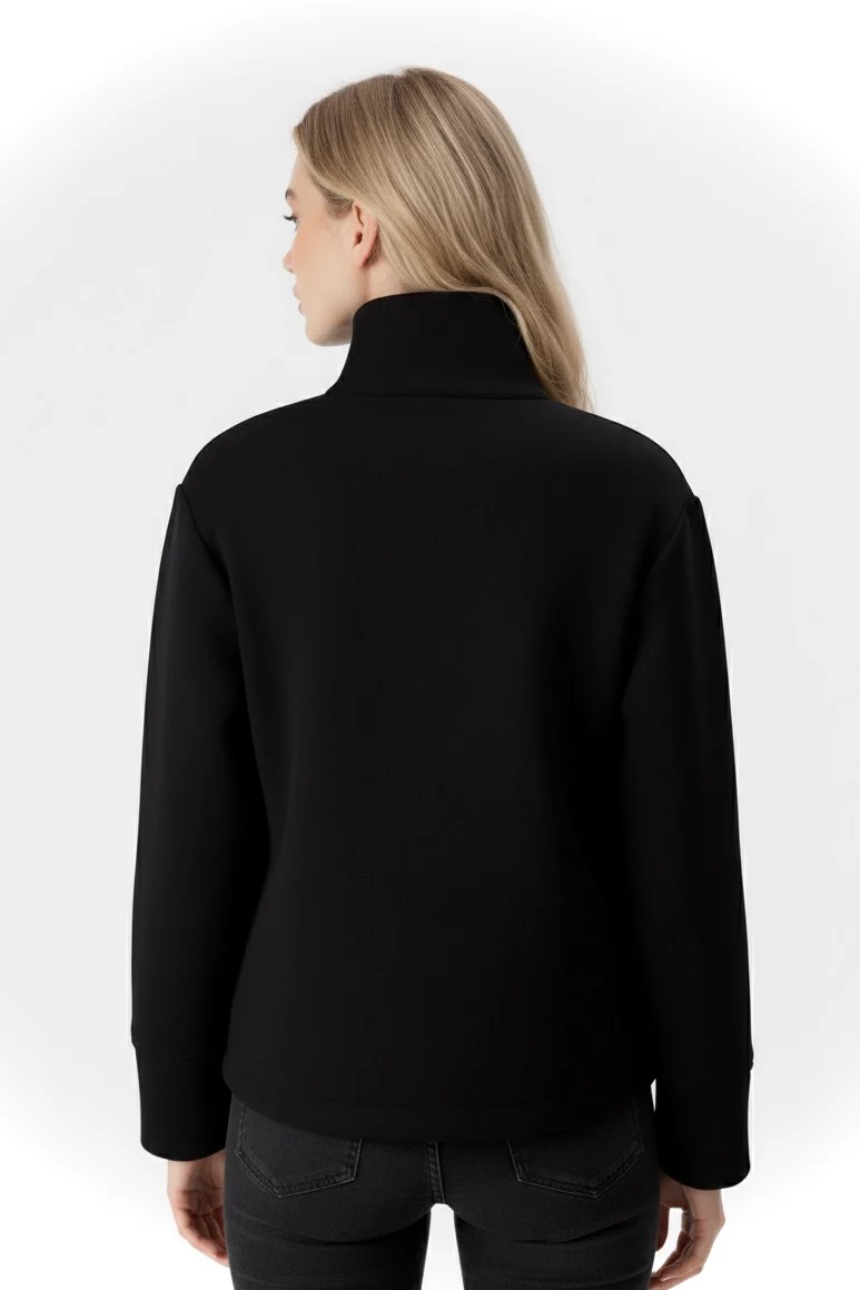 Martha High-Neck Wool-Blend Jacket featuring a structured stand collar, asymmetric button closure, smooth inner lining and a relaxed, slightly cropped silhouette. A warm yet polished layer that pairs with tailored trousers or high-waisted denim for transitional days.