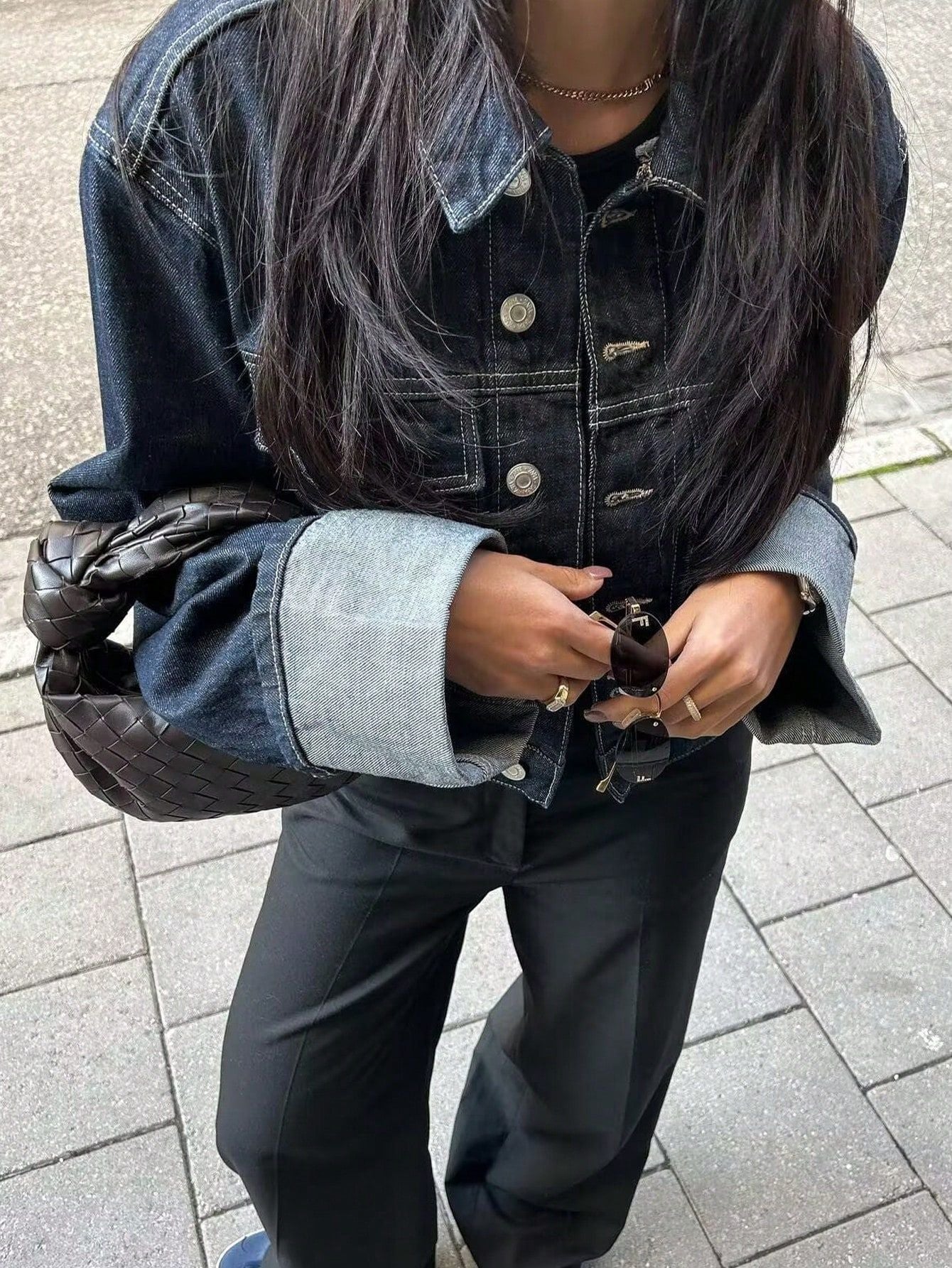 Dark indigo jacket with a boxy silhouette, rolled-up long sleeves, button-through front and neat chest pockets. Hip-skimming length and subtle paneled construction create a clean, modern layer over tees, knits or dresses for city-ready styling.