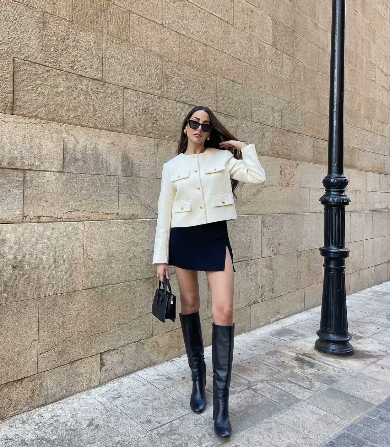 Vintage-inspired cropped jacket in a clean, round-neck design, finished with gold-tone buttons and four flap pockets. Tailored, waist-skimming silhouette in softly structured fabric adds a refined layer over dresses, denim or high-waisted trousers.