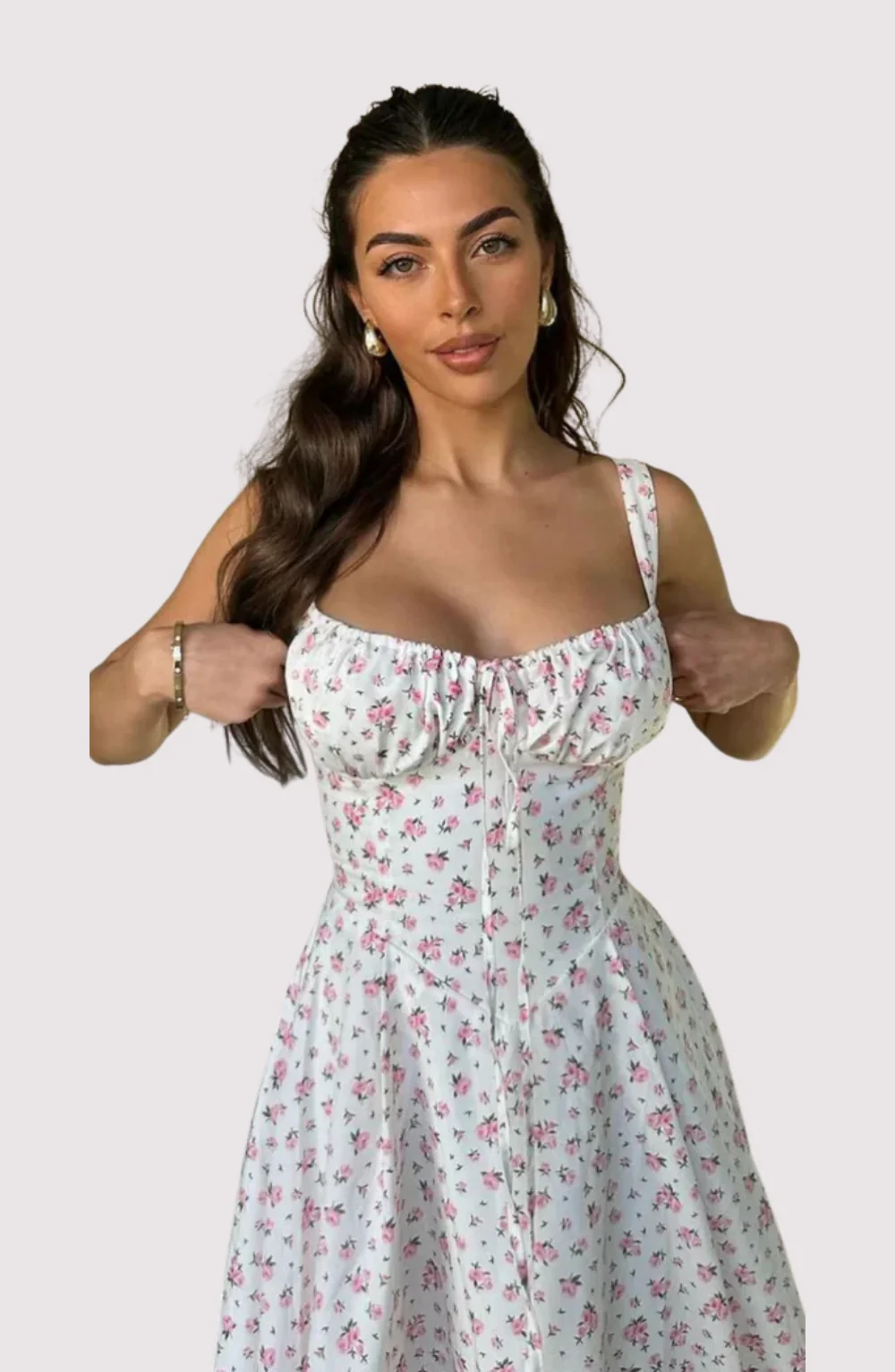 Meredith Corset Midi Dress in floral print poplin featuring a sweetheart neckline, gathered bust and structured, waist-cinching bodice. Softly flared midi skirt adds movement; romantic, versatile piece for weddings, brunches and summer parties.