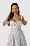 Meredith Corset Midi Dress in floral print poplin featuring a sweetheart neckline, gathered bust and structured, waist-cinching bodice. Softly flared midi skirt adds movement; romantic, versatile piece for weddings, brunches and summer parties.