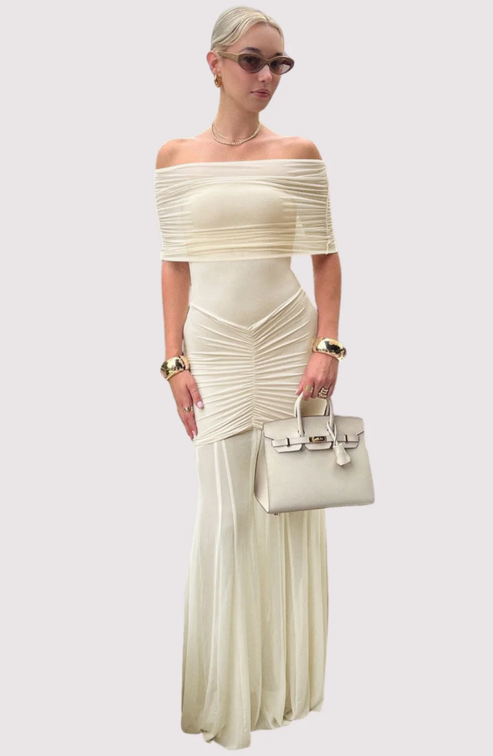 Michaela Maternity Off-Shoulder Pleated Mesh Maxi Dress featuring a stretch mesh overlay, softly fitted bodice, side ruching over the bump and a fluid, semi-sheer pleated skirt. Elegant, lightweight choice for baby showers, dinners and special evenings.