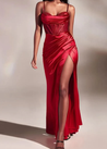 Moana satin-effect draped maxi dress featuring slim straps, a body-contouring silhouette and an elegant thigh slit. Lightweight drape flatters without showing folds, with elastane for a comfortable fit. Composition: Cotton, Satin, Polyester, Elastane.