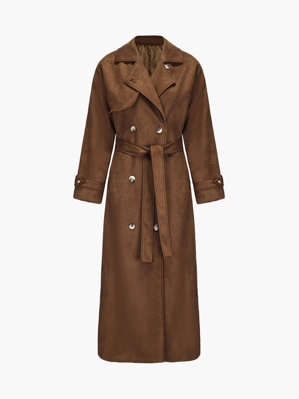 Molly faux suede trenchcoat featuring a velvety-soft finish, relaxed longline silhouette, buttoned front and waist-defining tie belt. Drapes comfortably over knits or dresses, adding refined, feminine style for transitional weather.