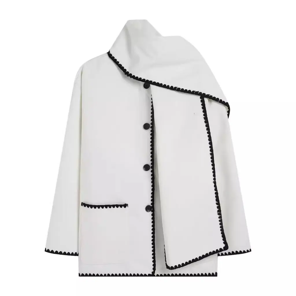 Nellie black wool-blend cape coat featuring a flowing silhouette with white contrast trim, front button fastening, practical side pockets and an attached oversized scarf collar. Warm, elegant outer layer that drapes over denim, knitwear or evening looks.