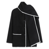 Nellie black wool-blend cape coat featuring a flowing silhouette with white contrast trim, front button fastening, practical side pockets and an attached oversized scarf collar. Warm, elegant outer layer that drapes over denim, knitwear or evening looks.