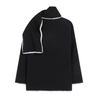 Nellie black wool-blend cape coat featuring a flowing silhouette with white contrast trim, front button fastening, practical side pockets and an attached oversized scarf collar. Warm, elegant outer layer that drapes over denim, knitwear or evening looks.